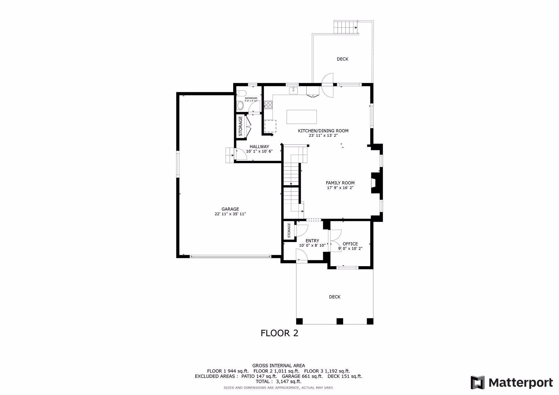 Second-floor plan with kitchen and dining room, family room, office, garage, and two decks.