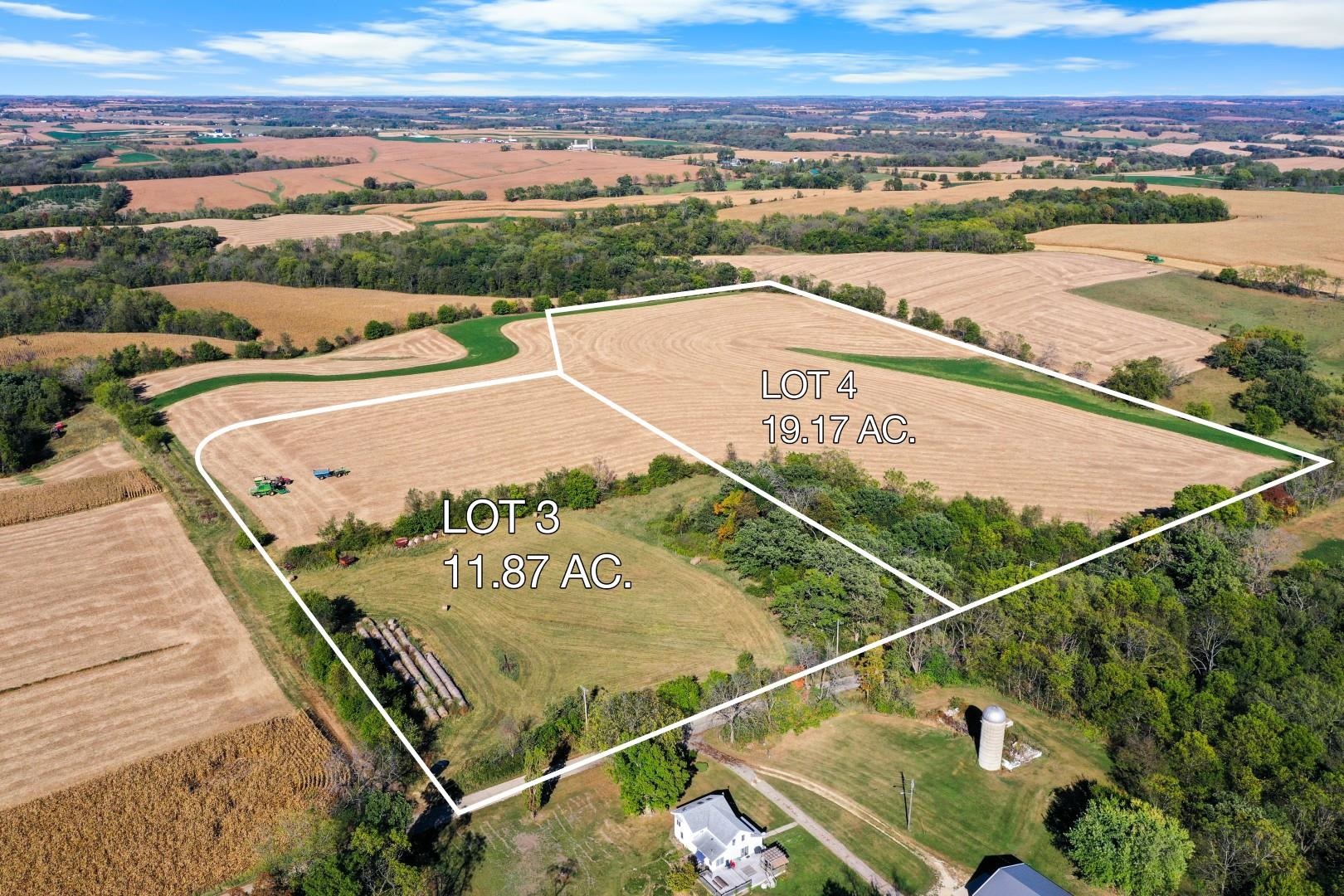 Aerial view of two outlined rural land parcels, Lots 3 and 4, among harvested fields.