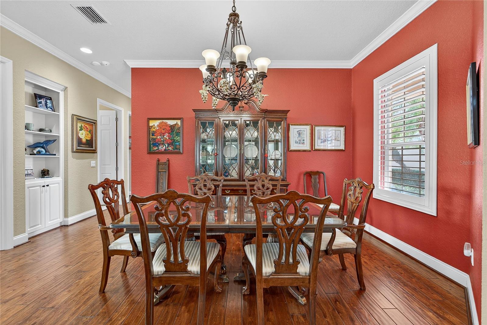 Formal dining space with wood floors and bright natural light