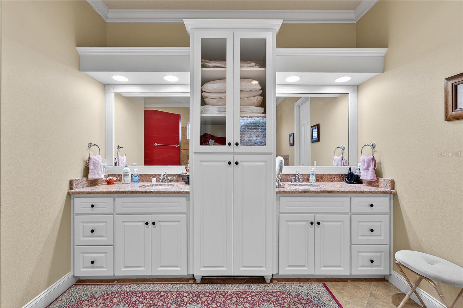 Dual vanity bathroom with granite countertops