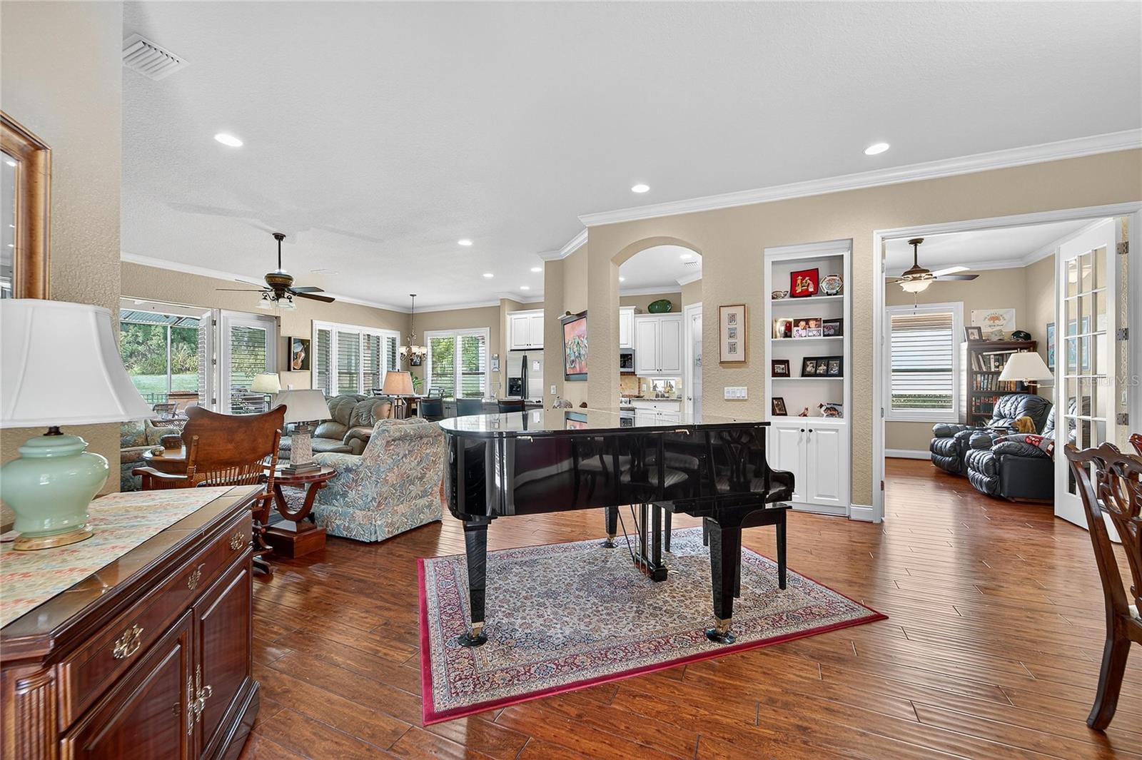 Open-concept living and dining room with hardwood floors