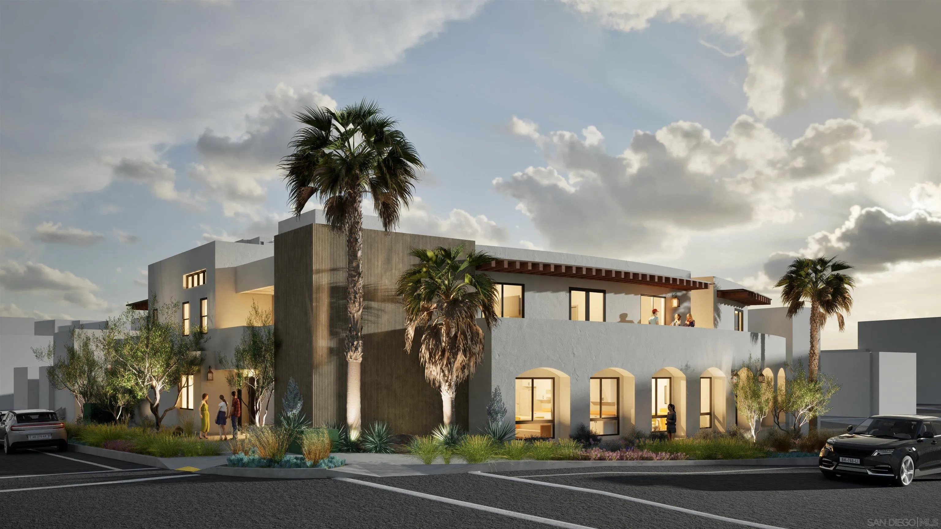 Modern multi-story residence with a second-floor terrace, arched windows, palm trees, and landscaped grounds.