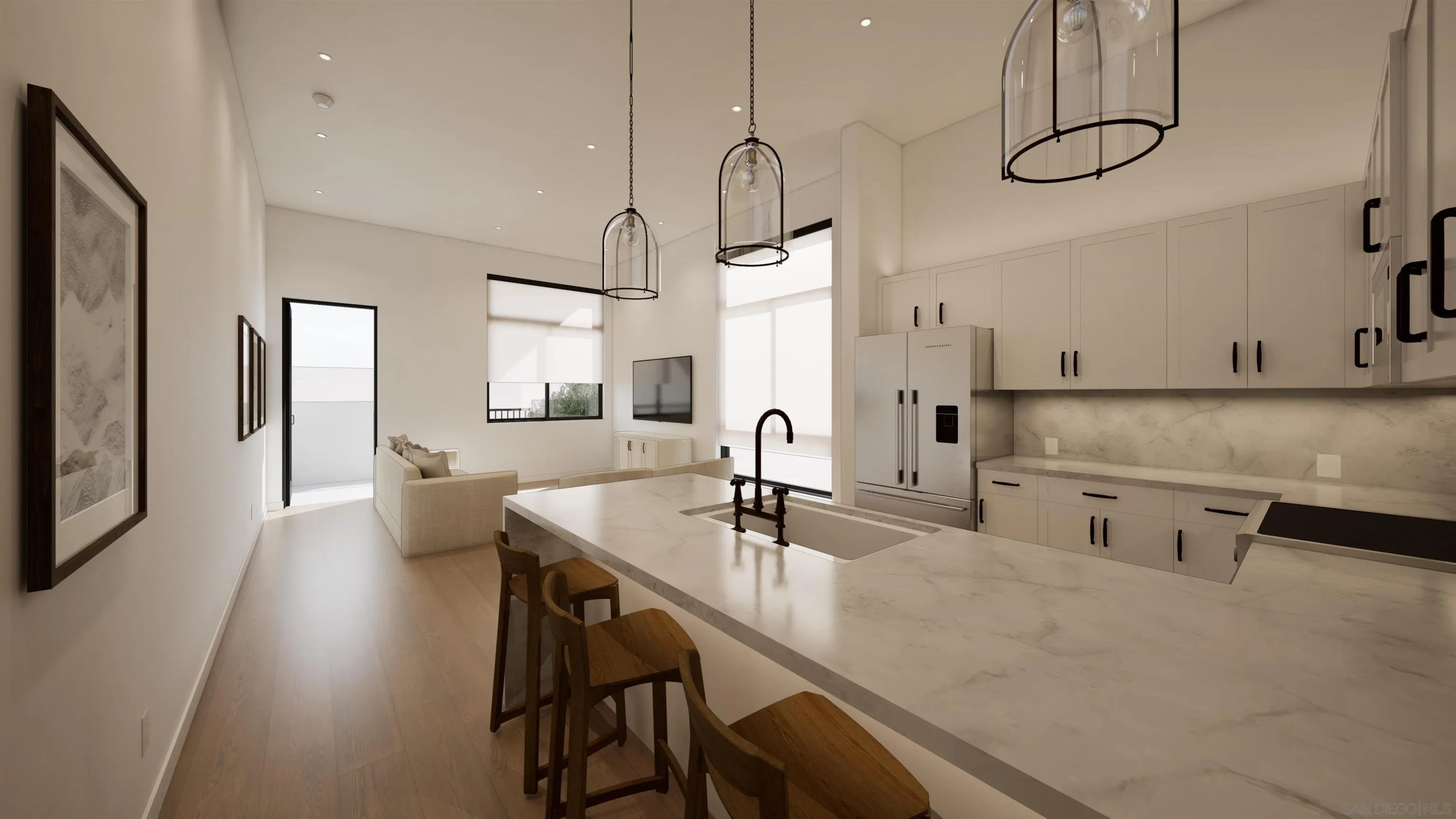 Modern open-plan kitchen with a marble island, dark wood stools, white cabinetry, and adjoining living area.