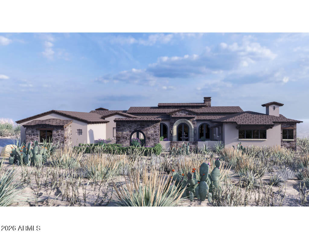 Single-story Southwestern home with a stone facade, arched entry, and cactus-filled desert landscaping.