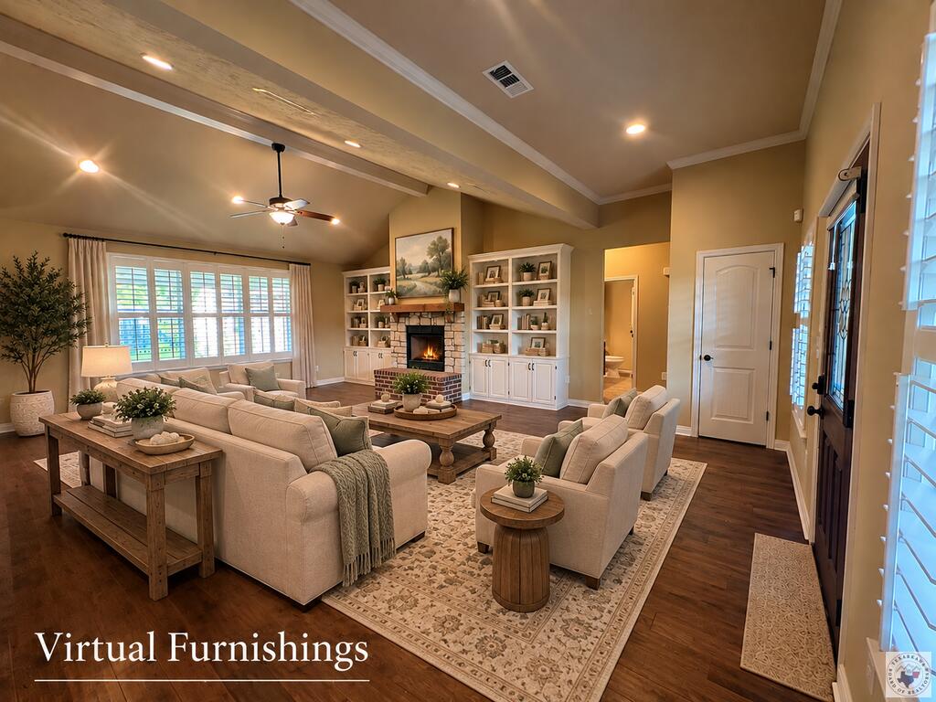 Virtually furnished living room with a stone fireplace, built-in shelves, and vaulted beam ceiling.