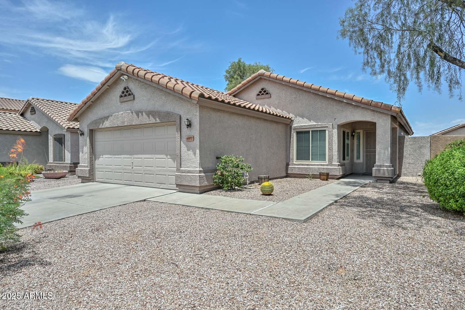 6972 W Aire Libre Avenue
