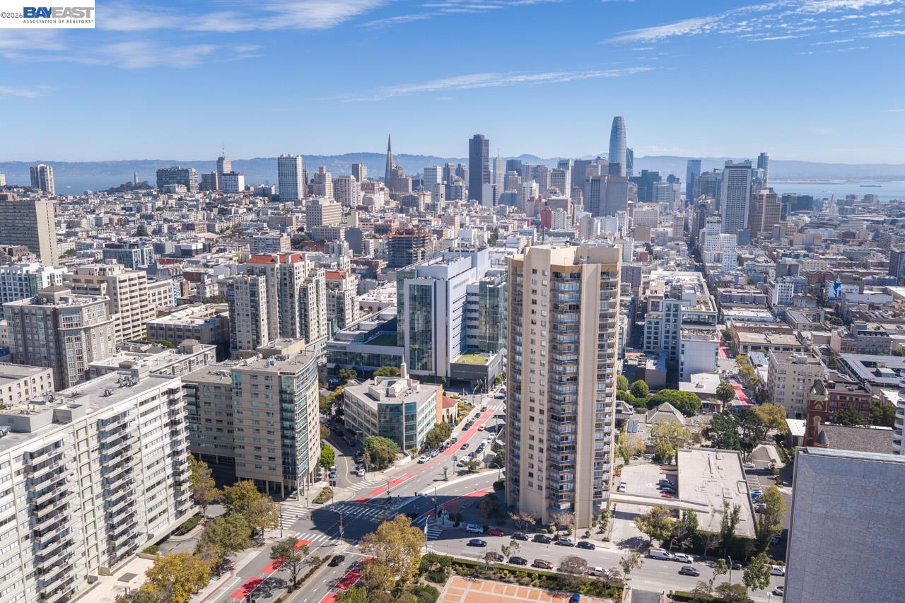 Aerial view of San Francisco’s skyline, with Salesforce Tower, the Transamerica Pyramid, and the bay.