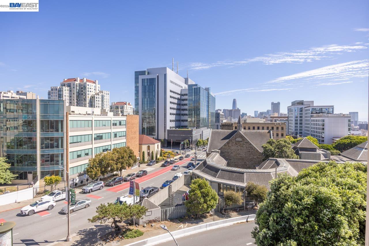 Elevated view of downtown San Francisco buildings and a busy street from 1200 Gough Street.