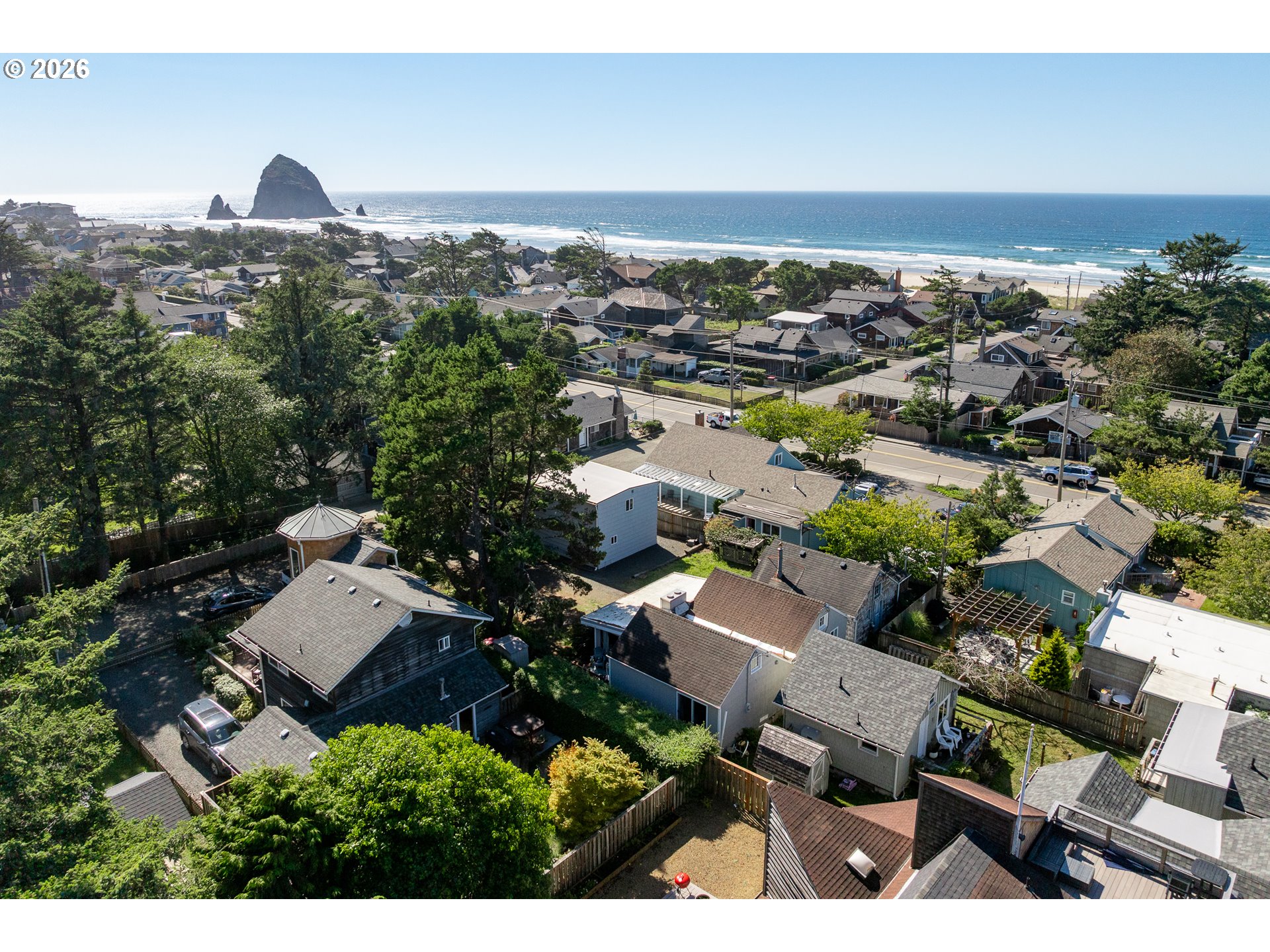 Aerial view of Cannon Beach homes, the Pacific Ocean, and Haystack Rock.