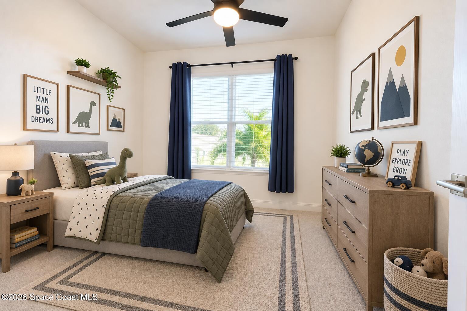 Staged child's bedroom with dinosaur decor, olive green bedding, navy curtains, and a large bright window.