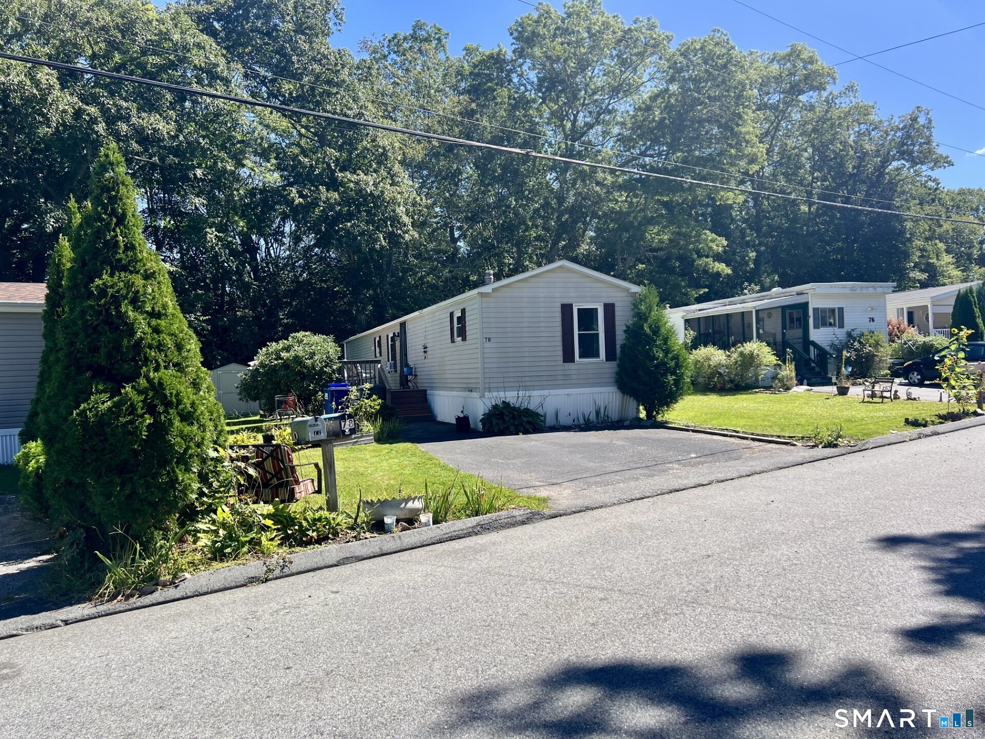 Single-story home at 78 Circle Drive with light siding, a front lawn, and paved driveway.