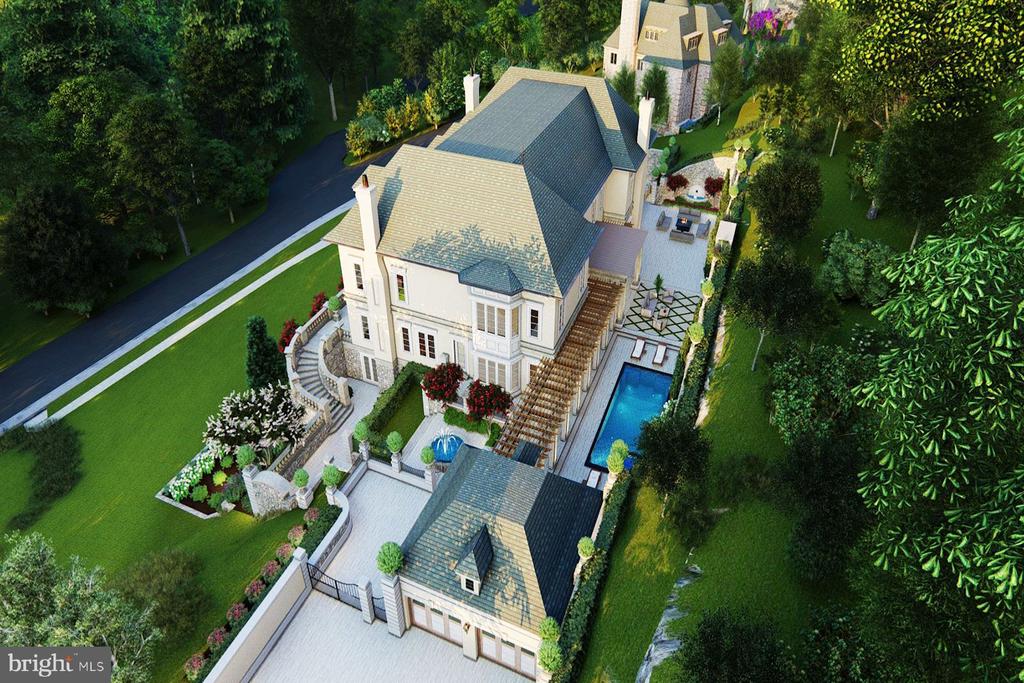 Aerial view of a large home with landscaped grounds and a swimming pool.
