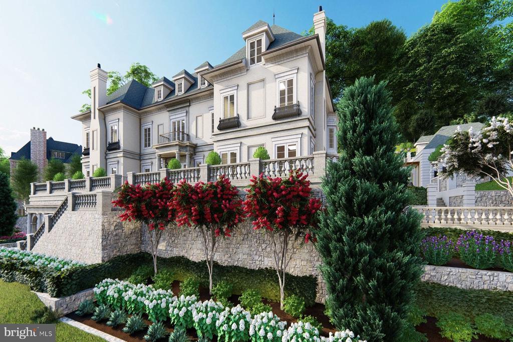 Large white house above a stone terrace, surrounded by flowering shrubs and landscaped gardens.