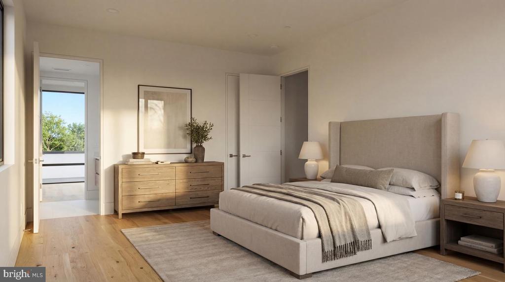 Staged bedroom with an upholstered bed, wood dresser, and open doorway to a balcony.