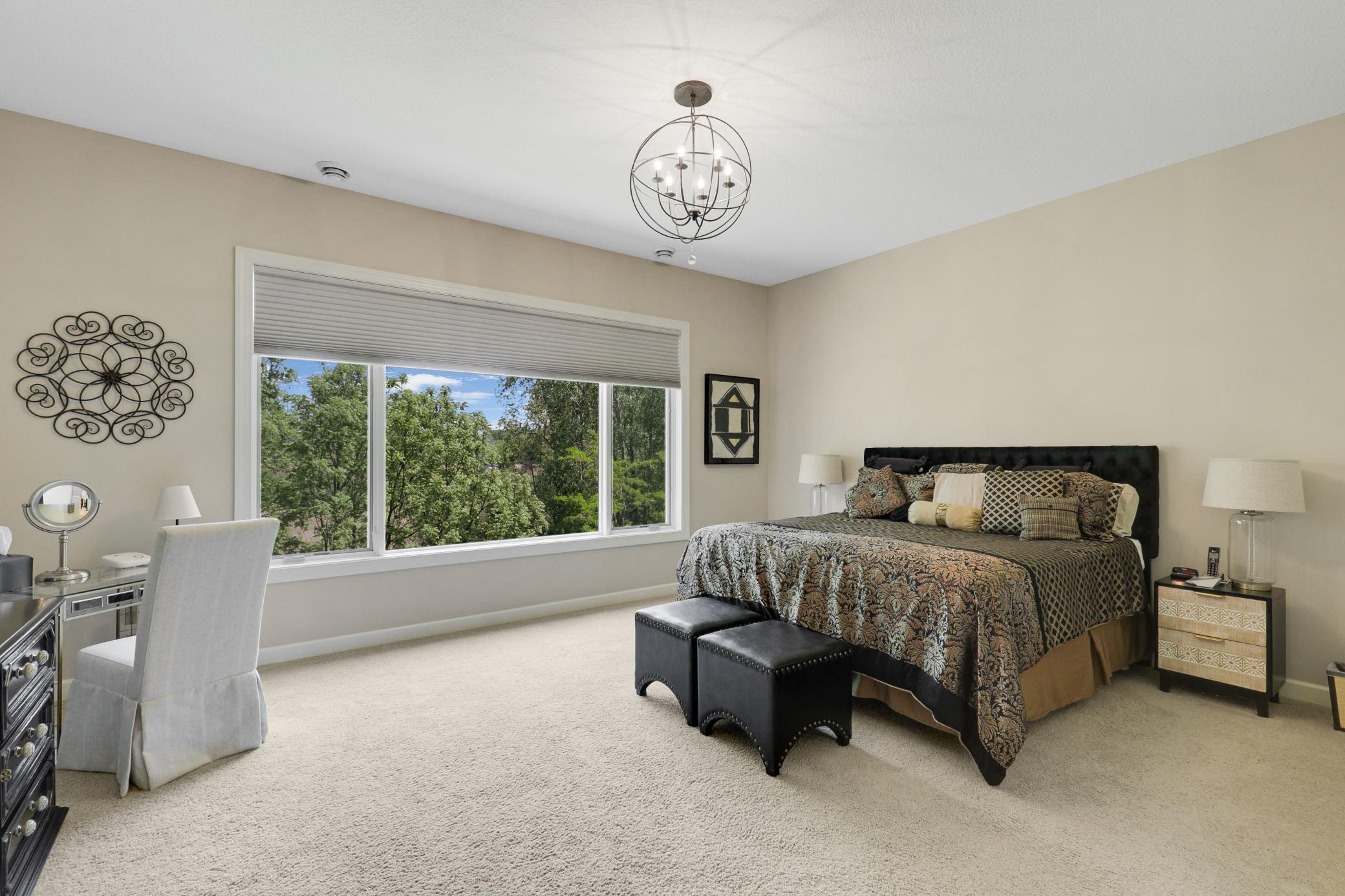Upscale end unit with main-floor living, a private elevator, walkable to shopping and restaurants