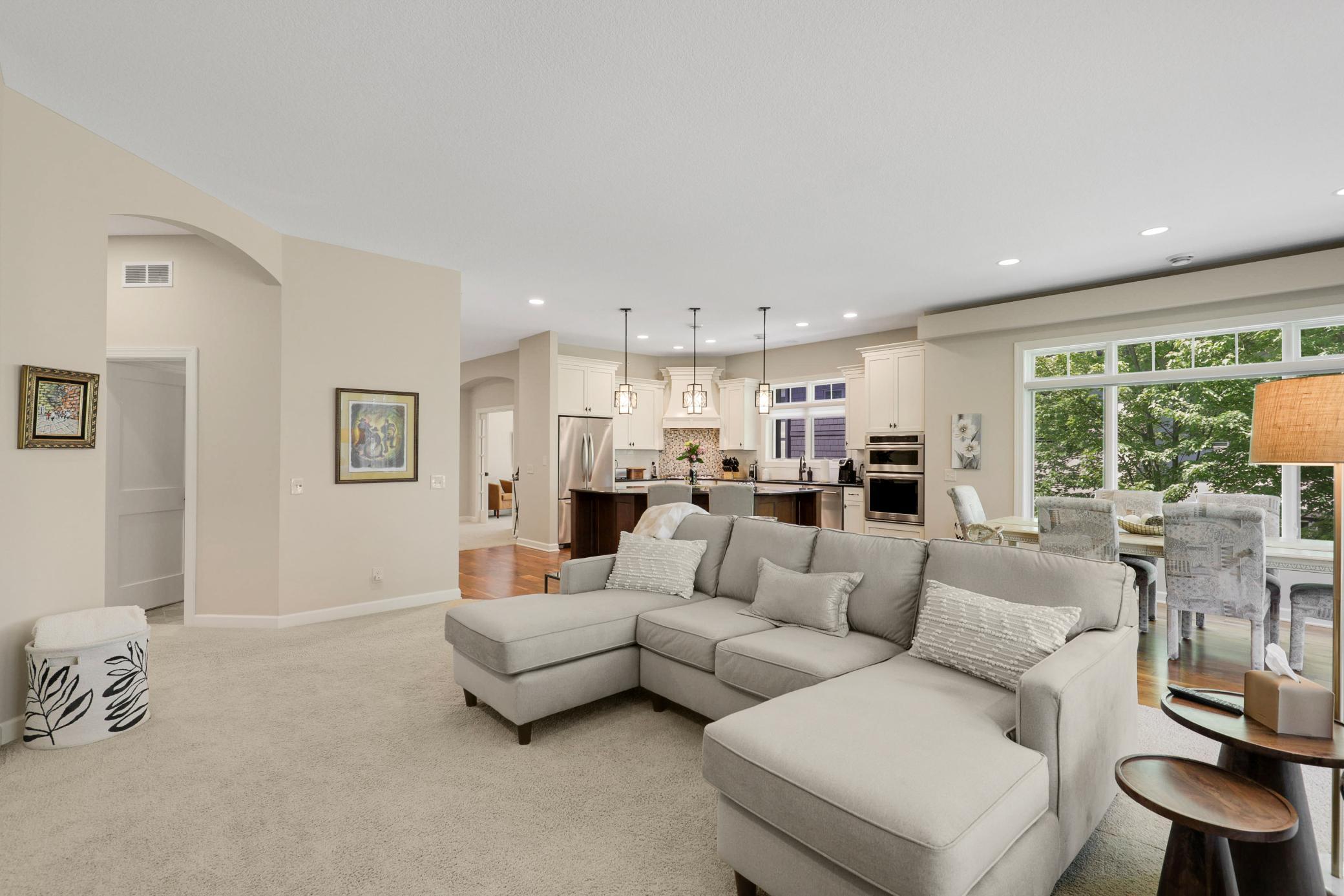 Upscale end unit with main-floor living, a private elevator, walkable to shopping and restaurants