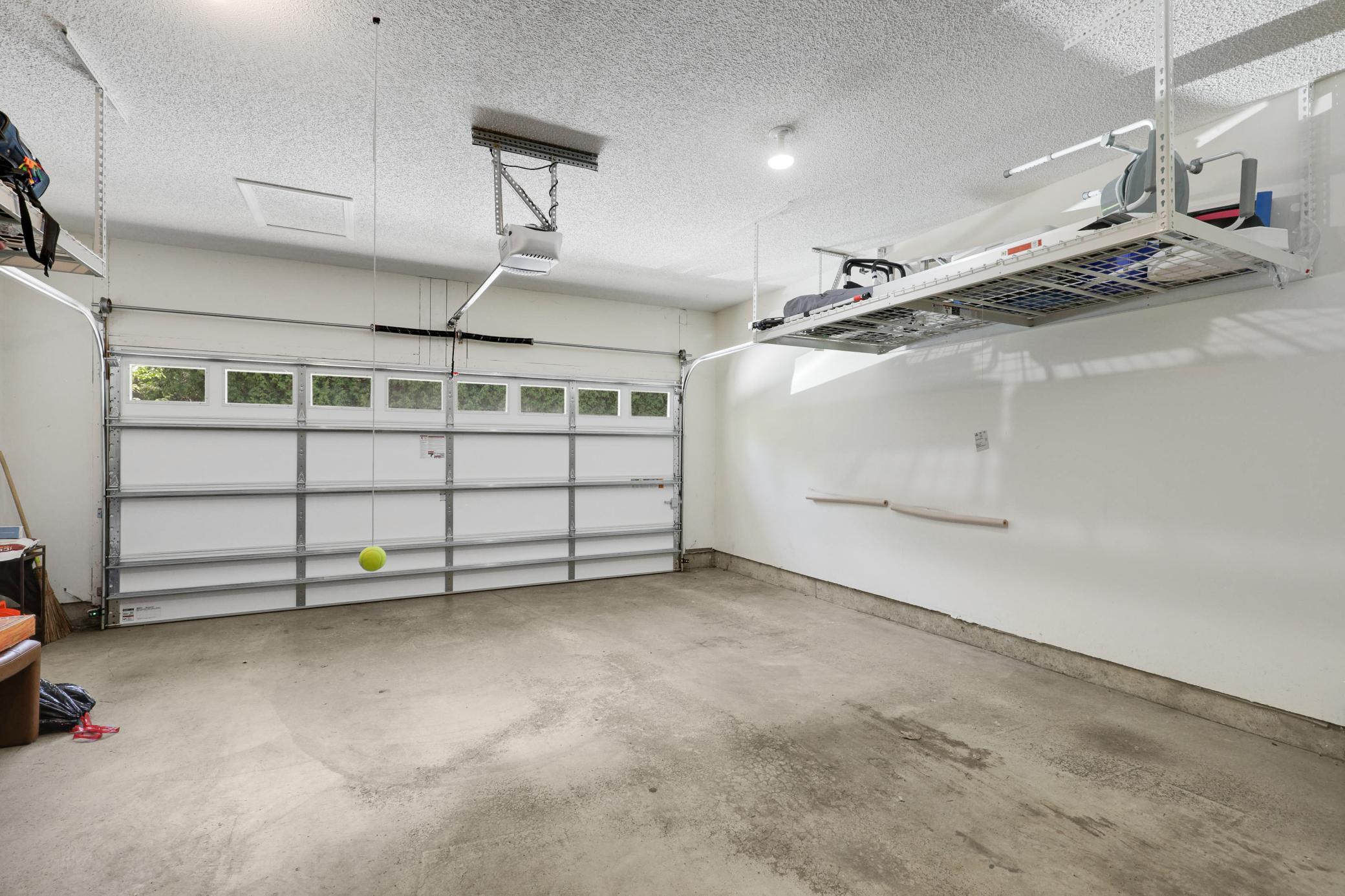 Upscale end unit with main-floor living, a private elevator, walkable to shopping and restaurants