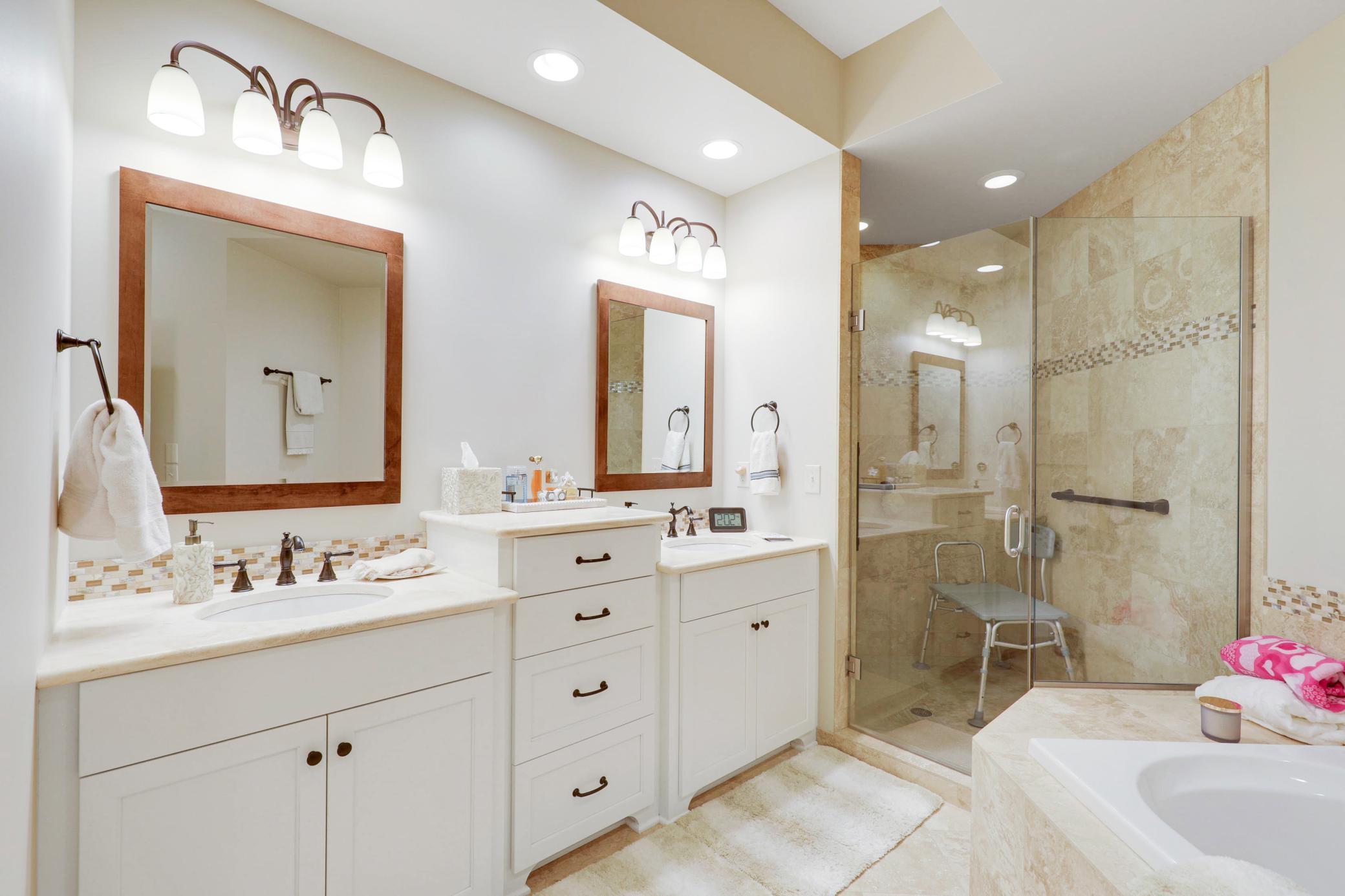 Upscale end unit with main-floor living, a private elevator, walkable to shopping and restaurants