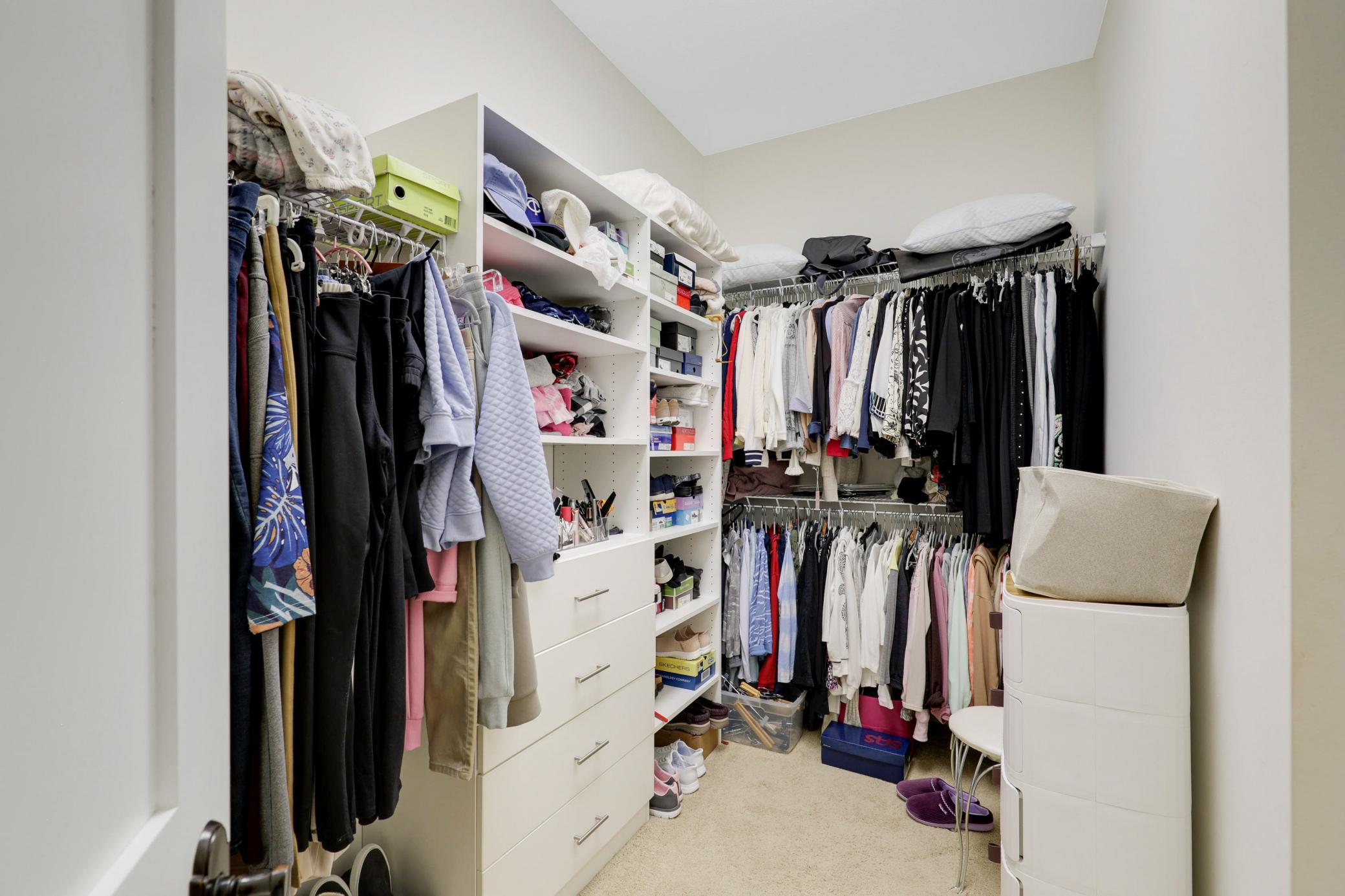 Upscale end unit with main-floor living, a private elevator, walkable to shopping and restaurants