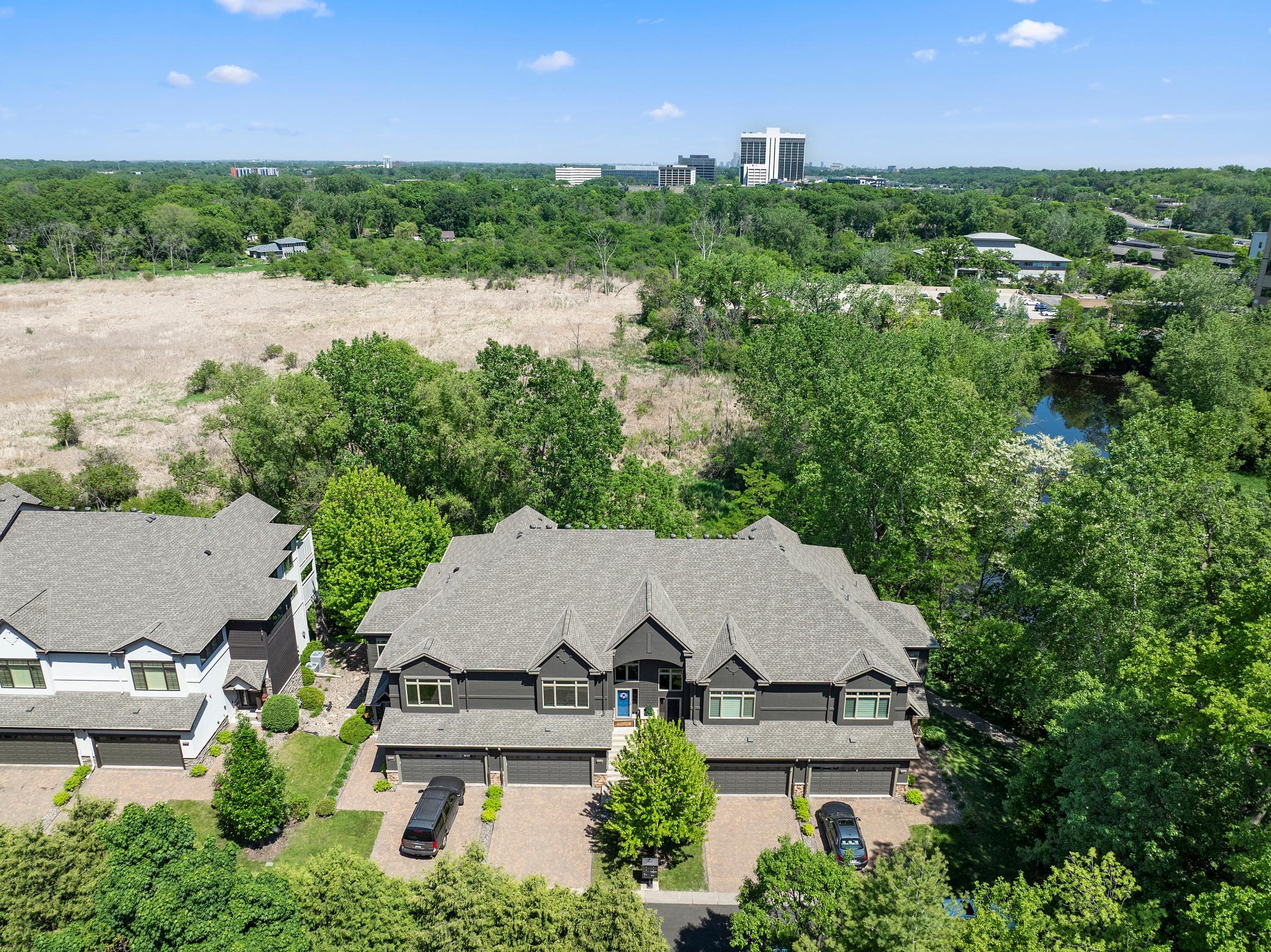 Upscale end unit with main-floor living, a private elevator, walkable to shopping and restaurants