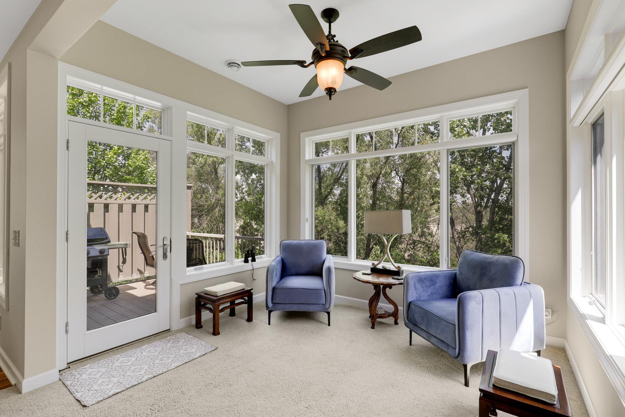 Upscale end unit with main-floor living, a private elevator, walkable to shopping and restaurants
