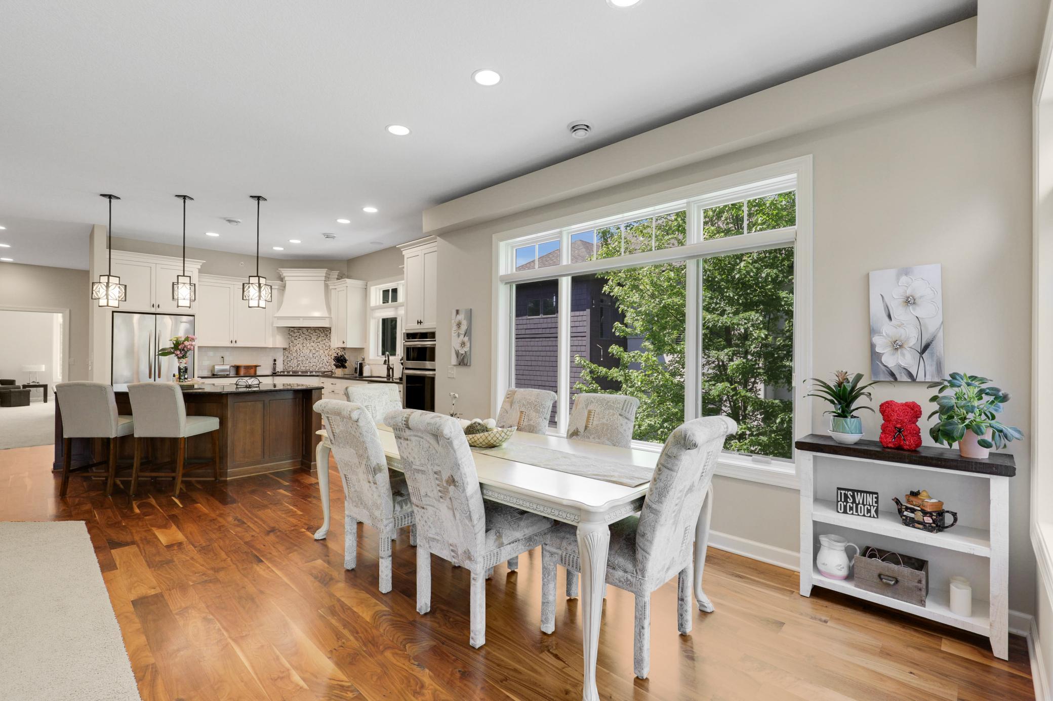 Upscale end unit with main-floor living, a private elevator, walkable to shopping and restaurants