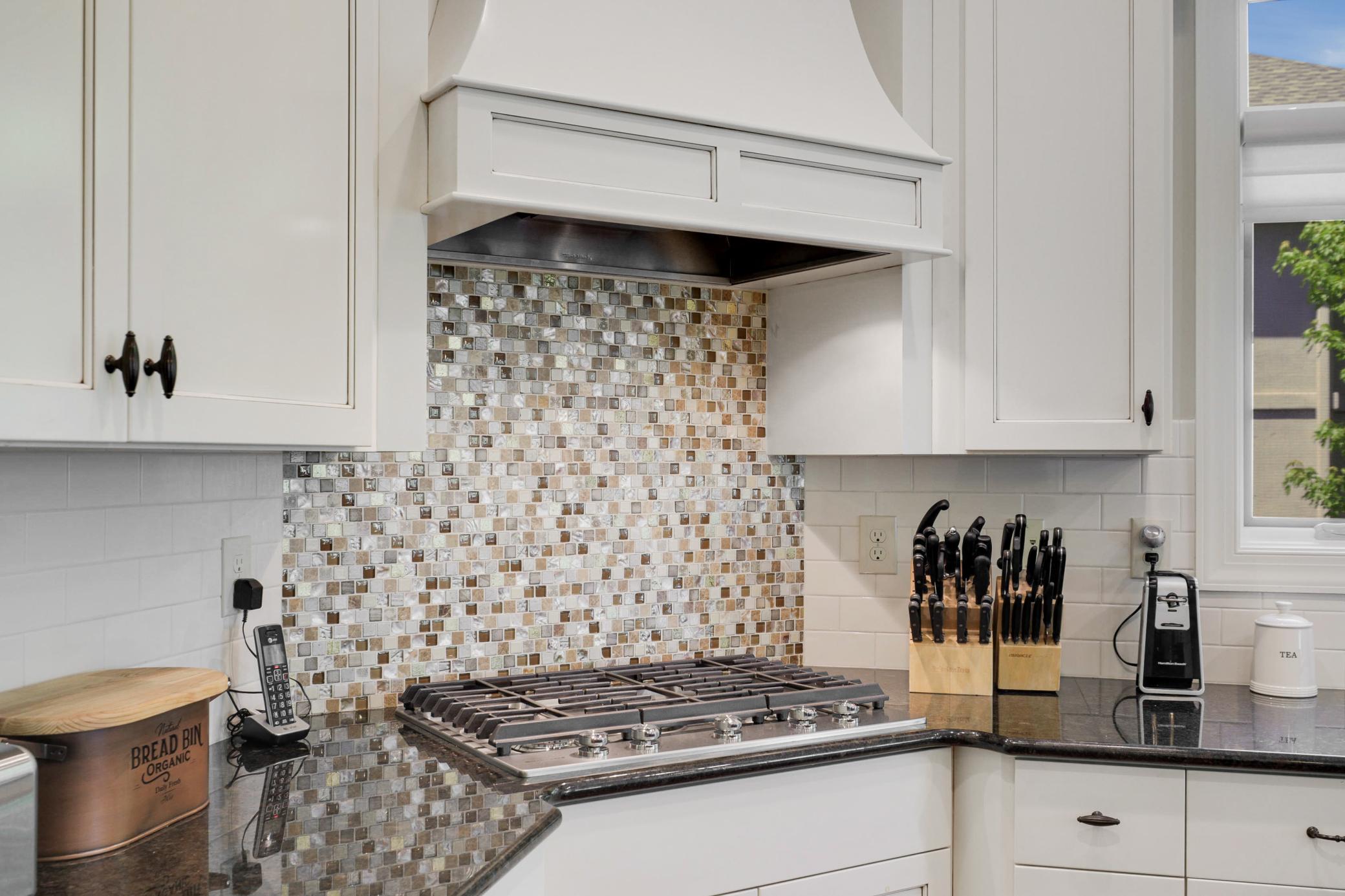 Upscale end unit with main-floor living, a private elevator, walkable to shopping and restaurants