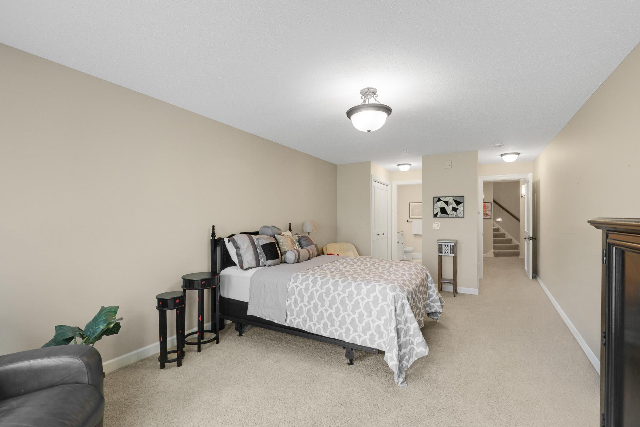 Upscale end unit with main-floor living, a private elevator, walkable to shopping and restaurants