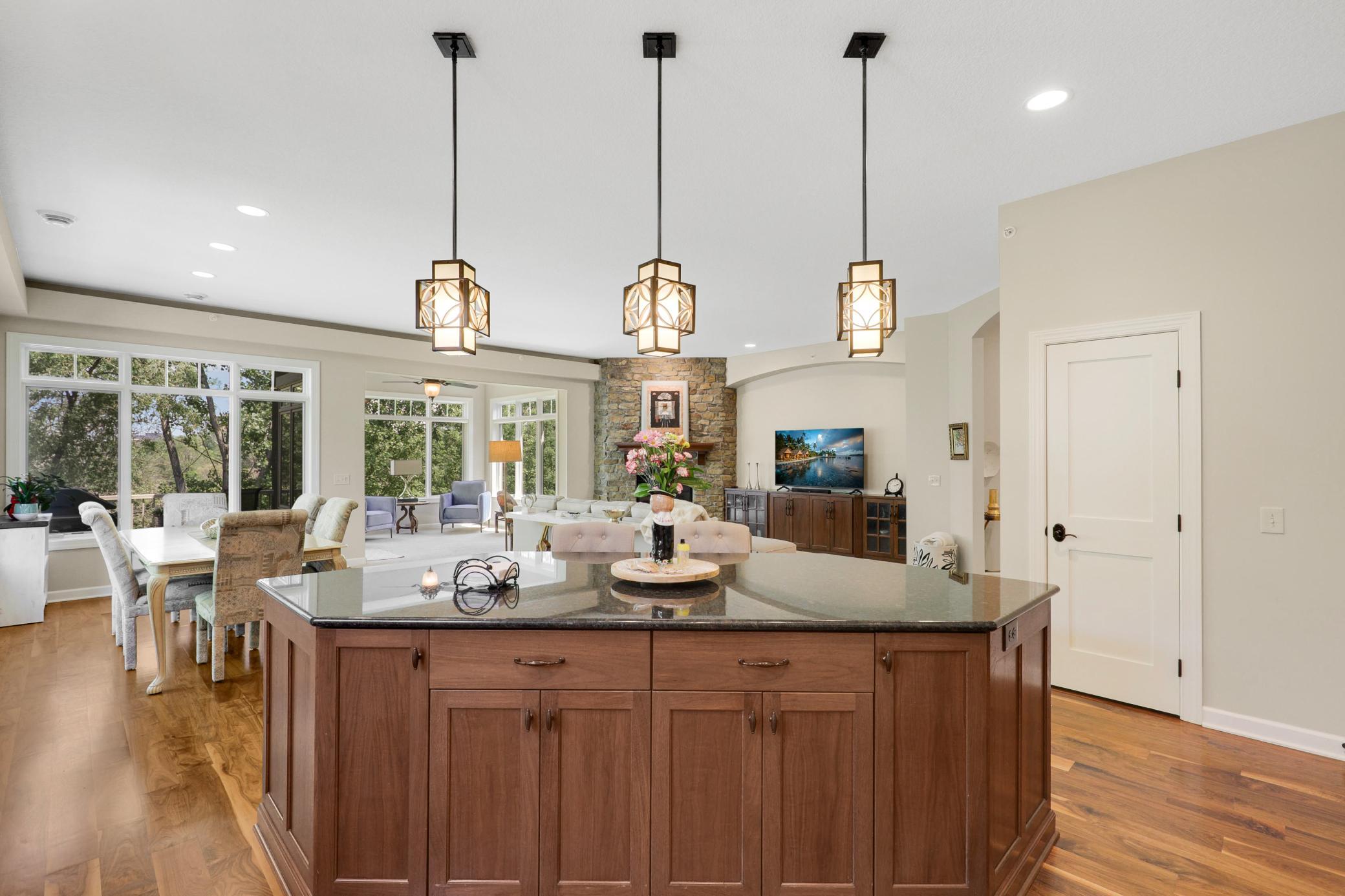 Upscale end unit with main-floor living, a private elevator, walkable to shopping and restaurants