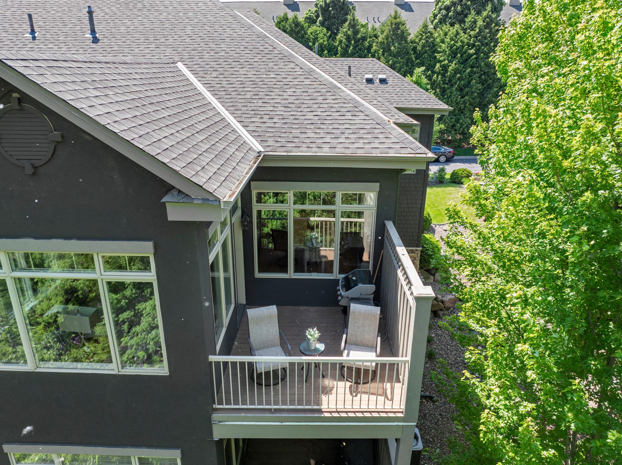 Upscale end unit with main-floor living, a private elevator, walkable to shopping and restaurants