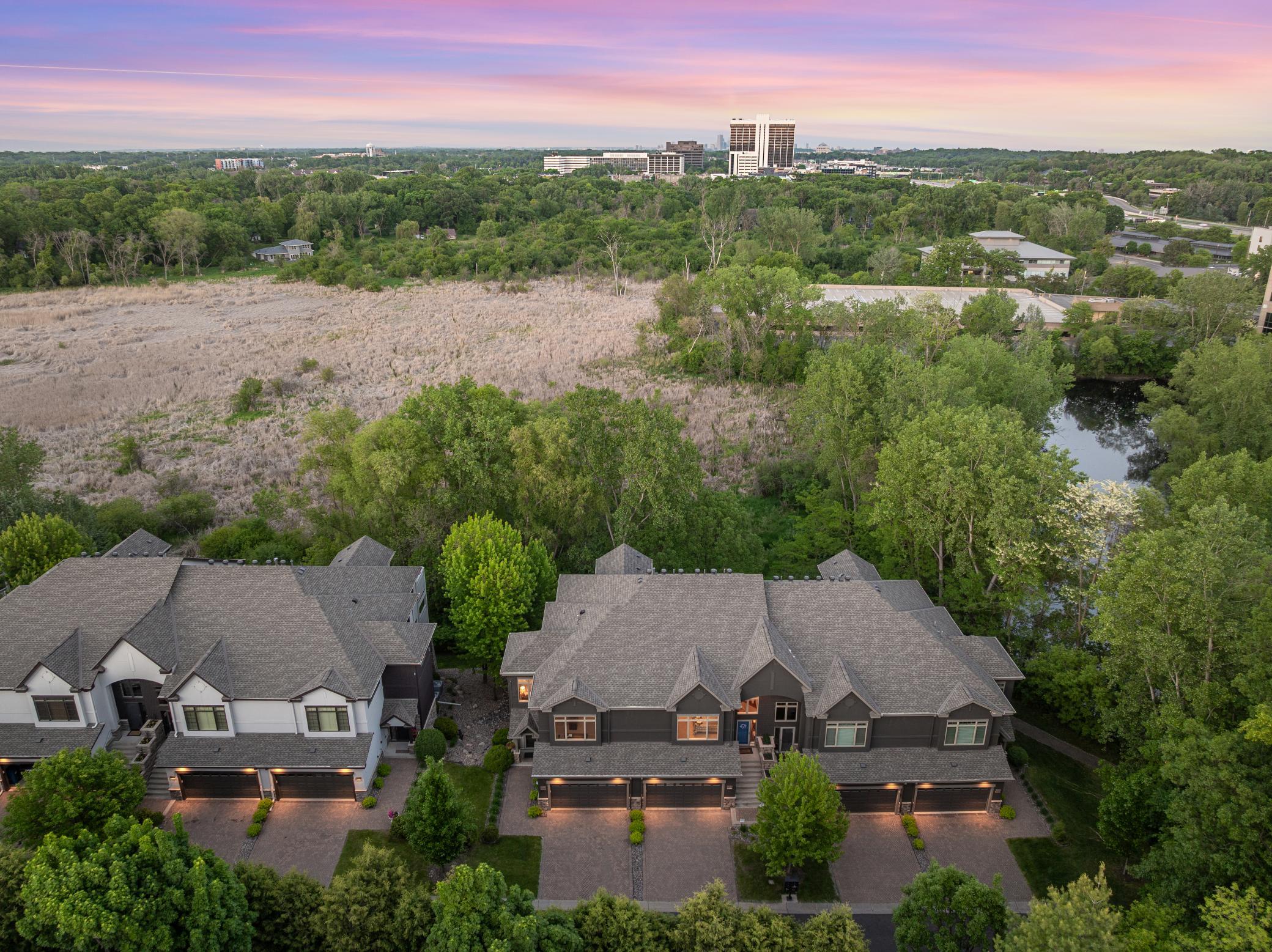 Upscale end unit with main-floor living, a private elevator, walkable to shopping and restaurants