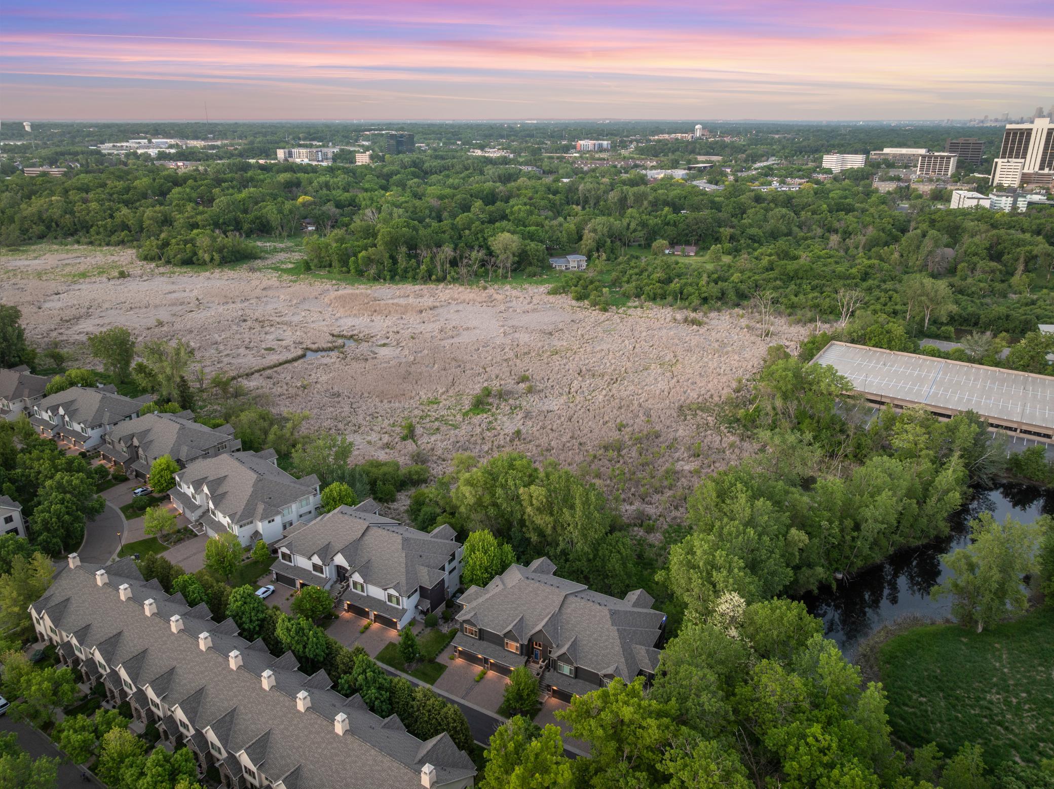 Upscale end unit with main-floor living, a private elevator, walkable to shopping and restaurants