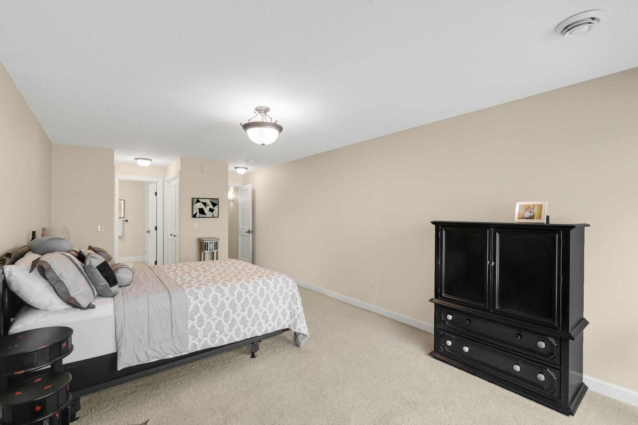 Upscale end unit with main-floor living, a private elevator, walkable to shopping and restaurants