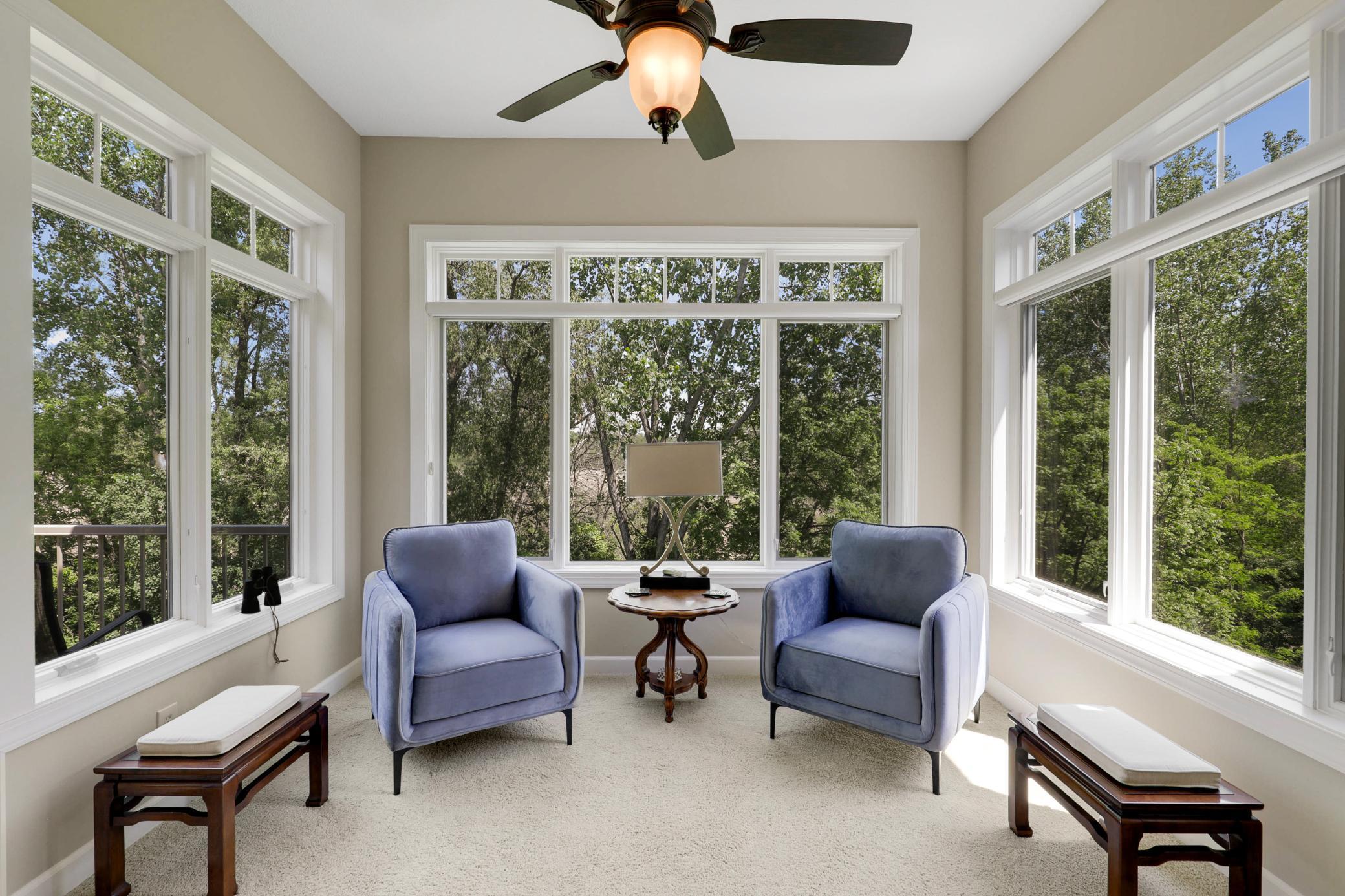 Upscale end unit with main-floor living, a private elevator, walkable to shopping and restaurants