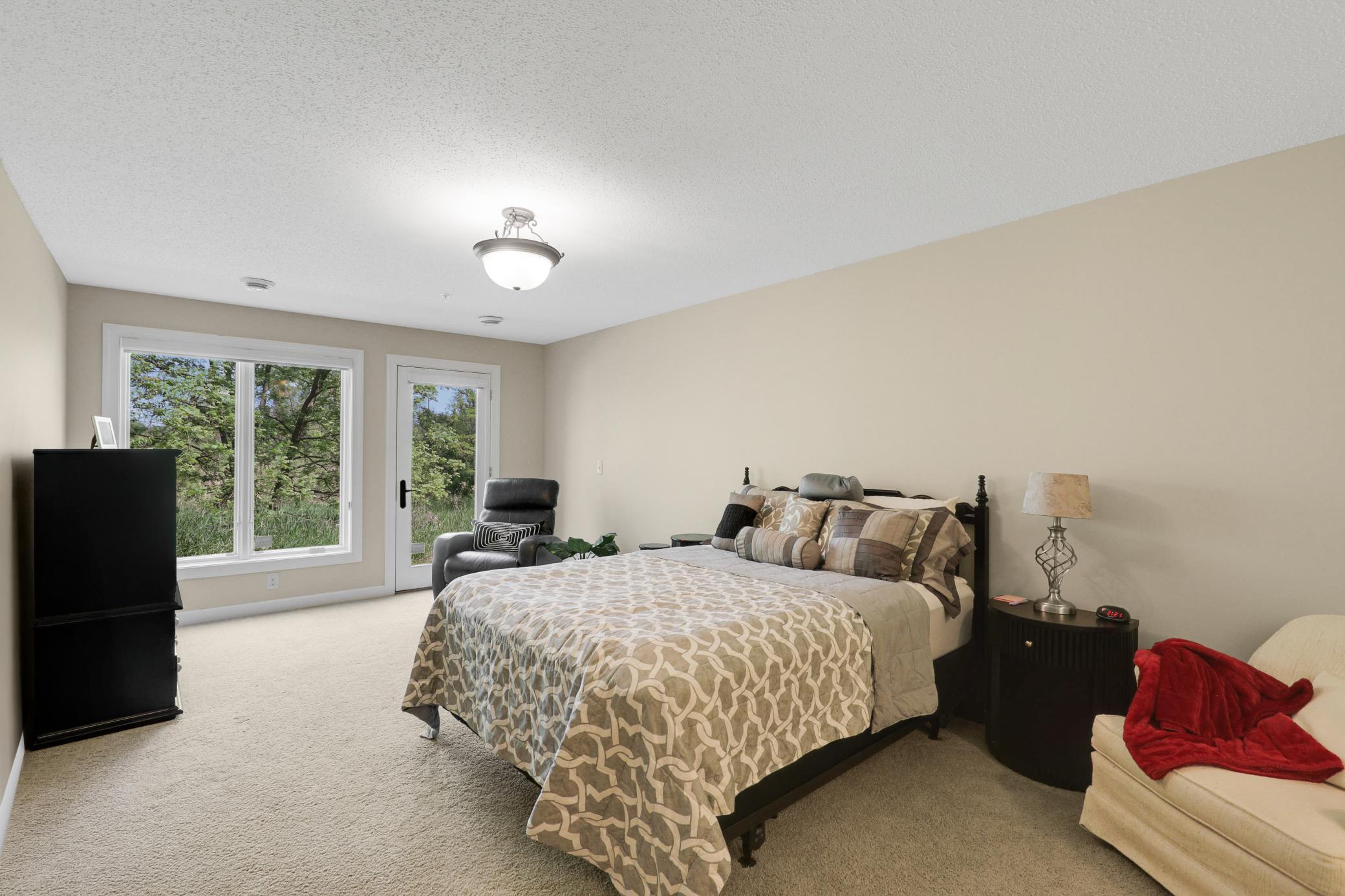 Upscale end unit with main-floor living, a private elevator, walkable to shopping and restaurants