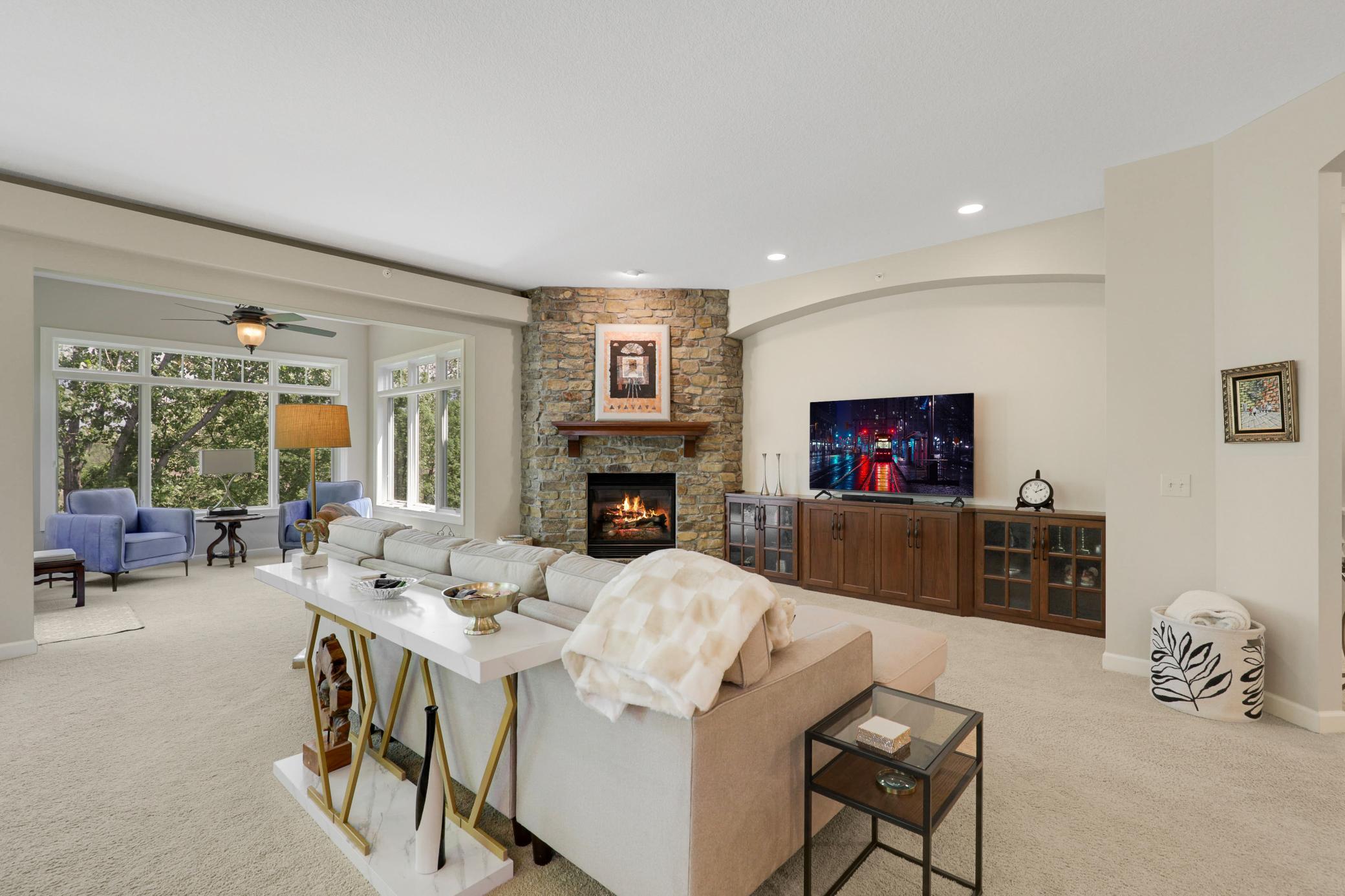 Upscale end unit with main-floor living, a private elevator, walkable to shopping and restaurants
