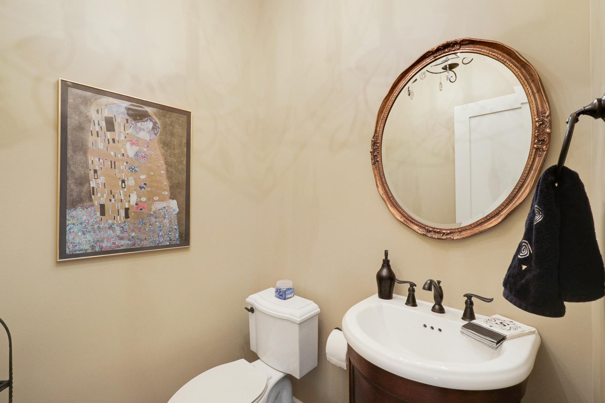 Upscale end unit with main-floor living, a private elevator, walkable to shopping and restaurants