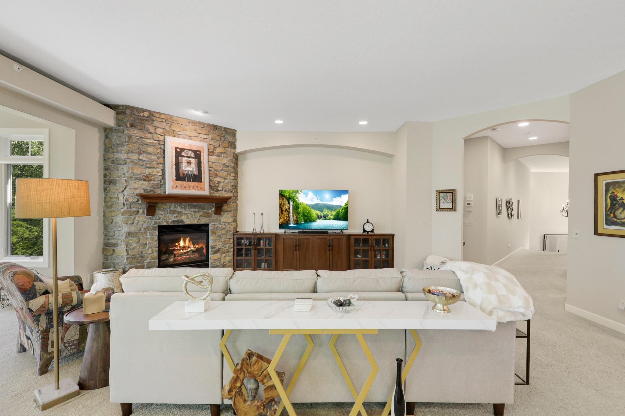Upscale end unit with main-floor living, a private elevator, walkable to shopping and restaurants