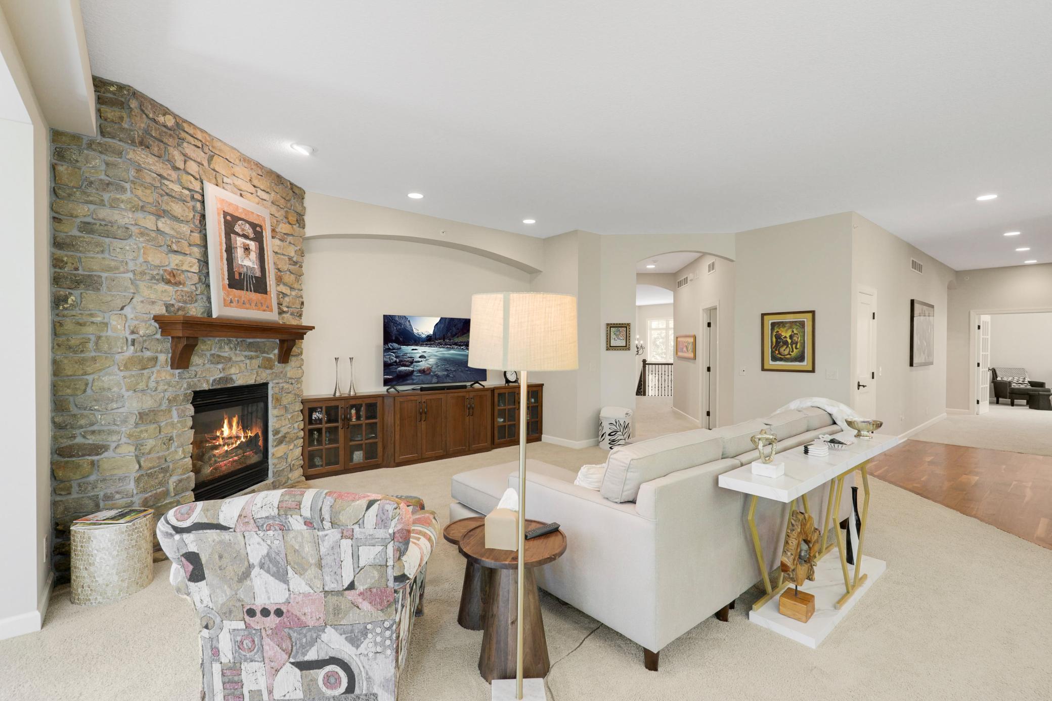Upscale end unit with main-floor living, a private elevator, walkable to shopping and restaurants