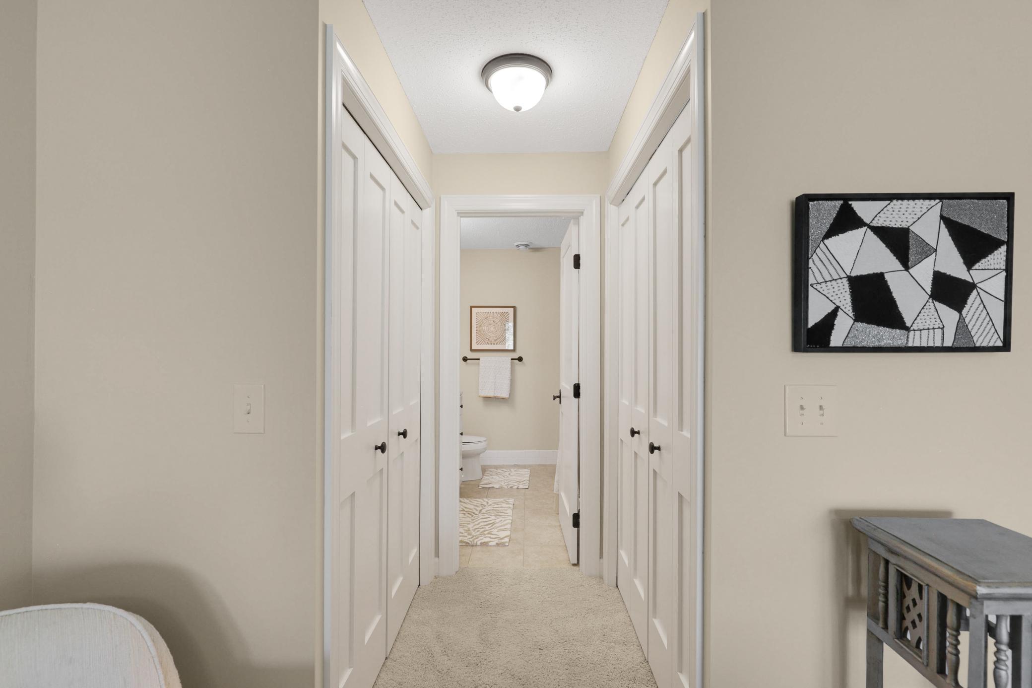 Upscale end unit with main-floor living, a private elevator, walkable to shopping and restaurants