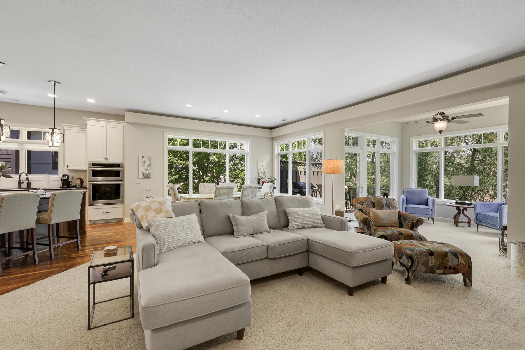 Upscale end unit with main-floor living, a private elevator, walkable to shopping and restaurants