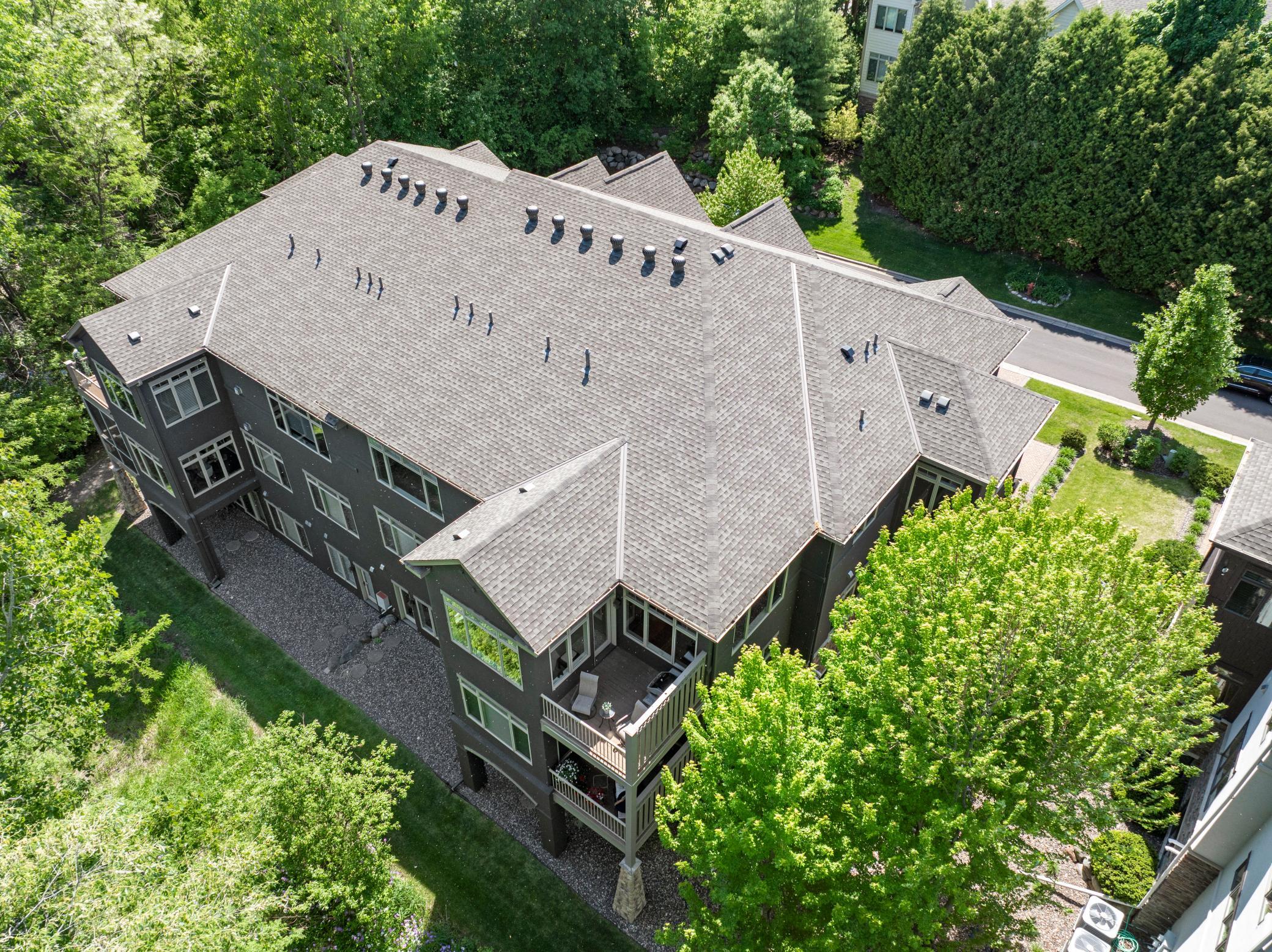 Upscale end unit with main-floor living, a private elevator, walkable to shopping and restaurants