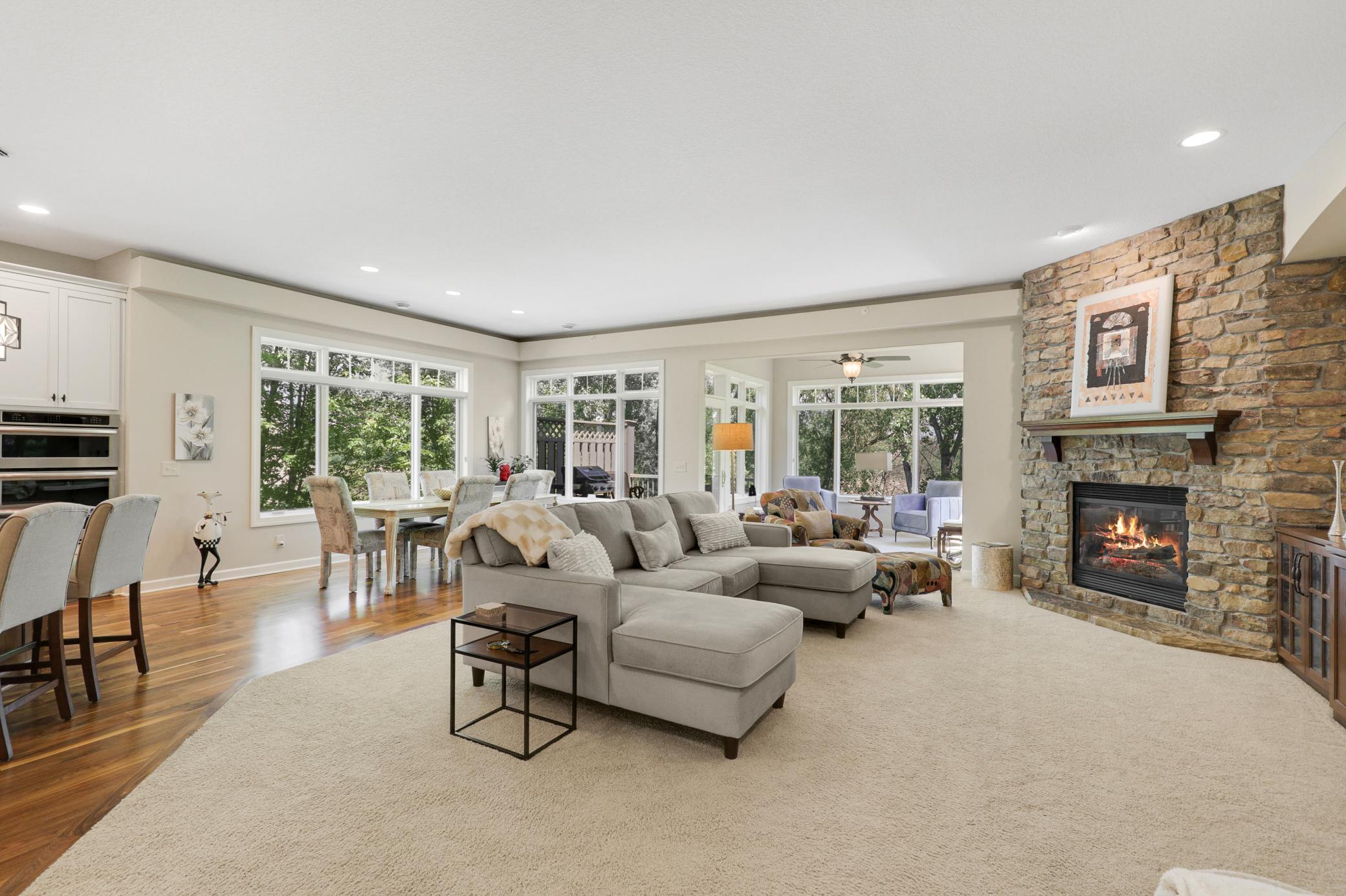 Upscale end unit with main-floor living, a private elevator, walkable to shopping and restaurants