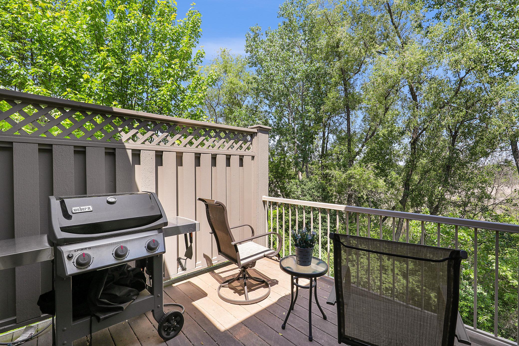 Upscale end unit with main-floor living, a private elevator, walkable to shopping and restaurants