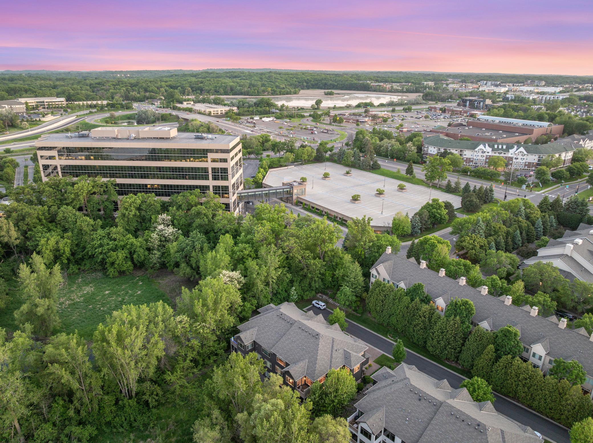 Upscale end unit with main-floor living, a private elevator, walkable to shopping and restaurants