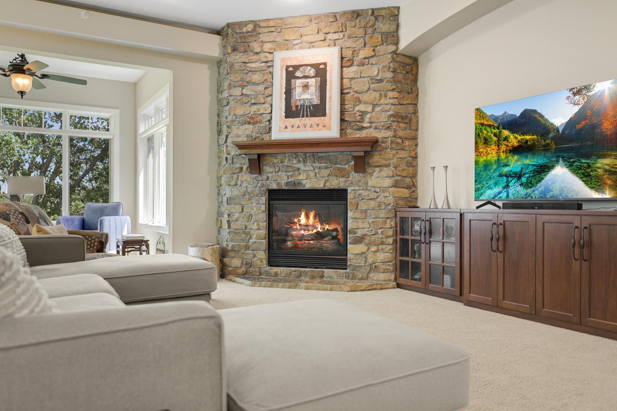 Upscale end unit with main-floor living, a private elevator, walkable to shopping and restaurants