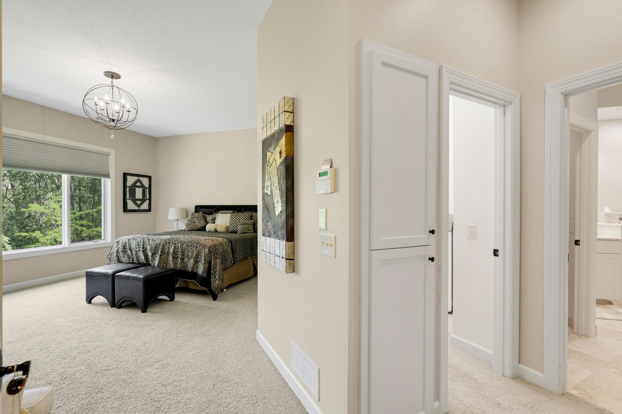 Upscale end unit with main-floor living, a private elevator, walkable to shopping and restaurants