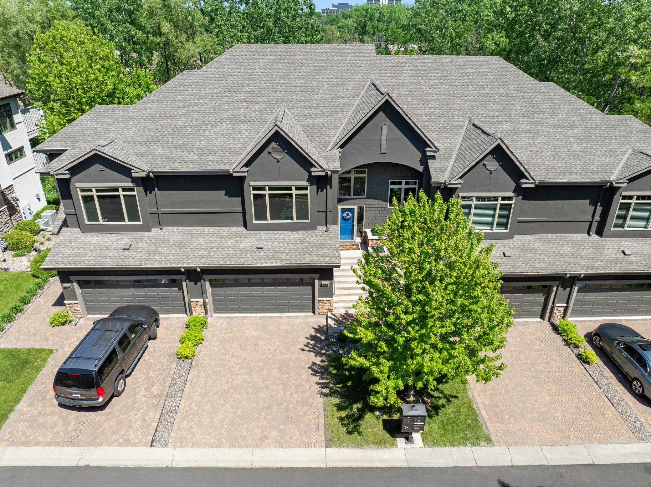 Upscale end unit with main-floor living, a private elevator, walkable to shopping and restaurants