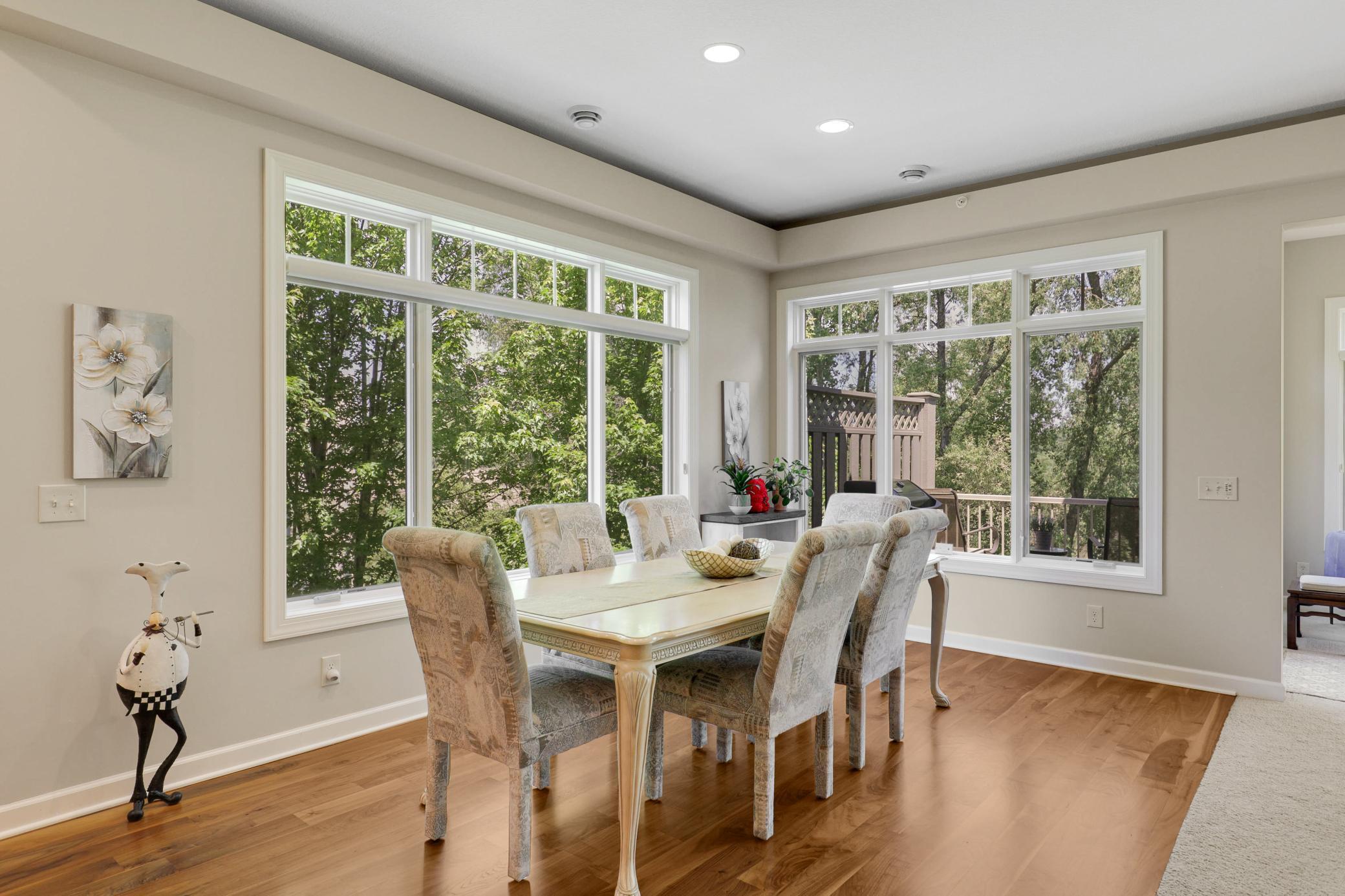 Upscale end unit with main-floor living, a private elevator, walkable to shopping and restaurants