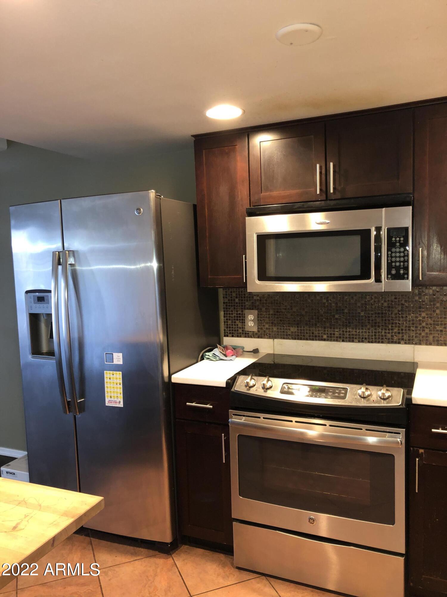 8211 E GARFIELD Street Unit: J13